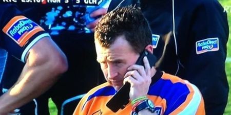 What was Nigel Owens doing on his mobile phone during the Munster match last night?