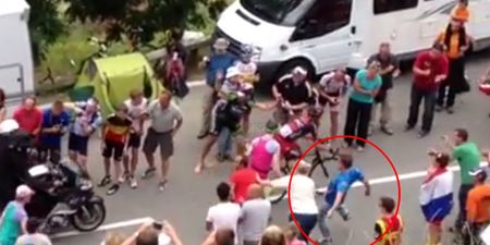 Video: Fan gets tripped while chasing cyclist in the Tour de France