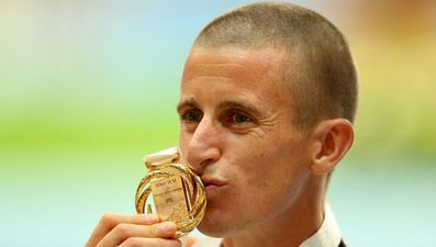 Pic: Rob Heffernan beams as he receives his World Championship gold medal