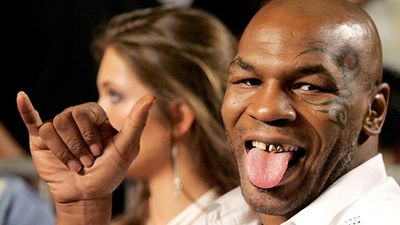 Pic: A far cry from The Hangover, Mike Tyson poses with newlyweds
