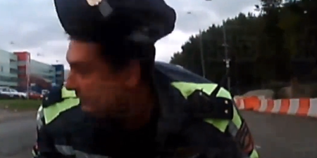 Video: Russian cop gets taken for a ride on the hood of a car