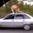 Video: Russian bloke goes surfing on top of a speeding car