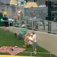 Video: Great catch from a basball fan in the crowd, apart from the bit where he slams his face into a wall