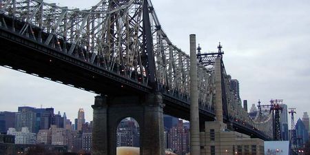 Pics: Large plume of black smoke streams from the centre of New York bridge