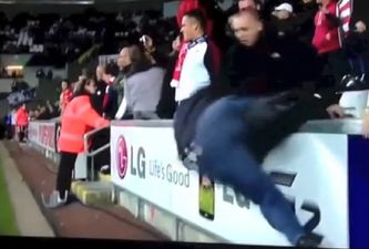 Video: One Liverpool fan hilariously fell over while trying to get his hands on Sturridge’s shirt