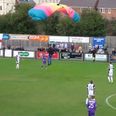 “He dived ref!” – Parachutist bizarrely lands on football pitch in the middle of game