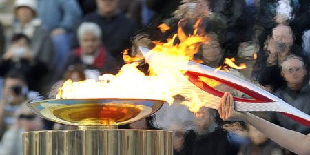 Video: Russian security agent breaks tradition and relights Olympic torch with a Zippo