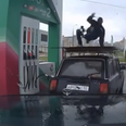 Video: Russian fuel attendant break dances on top of customer’s car