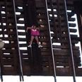 Video: Woman left clinging to railway bridge 22 feet in the air after railway crossing opens