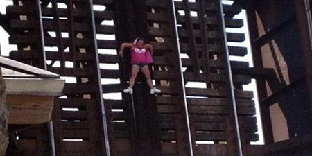 Video: Woman left clinging to railway bridge 22 feet in the air after railway crossing opens