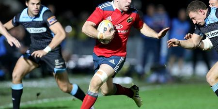 Picture: Munster’s J.J. Hanrahan with an epic hand off in tonight’s game against Glasgow