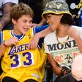 This young lad looked delighted to be sitting next to Rihanna at the Lakers game