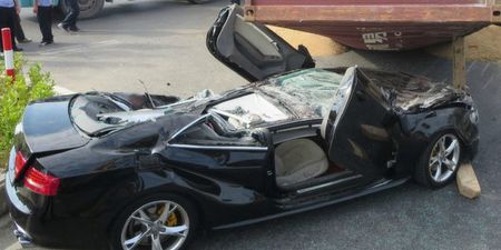 Pic: Couple survive after shipping container falls on car