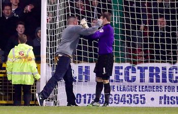 Video: Disgraceful scenes at Swindon as home supporter punches Leyton Orient goalkeeper