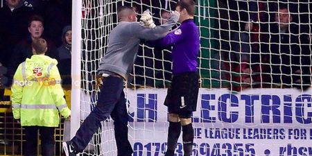 Video: Disgraceful scenes at Swindon as home supporter punches Leyton Orient goalkeeper