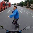 Video: Motorcyclist nearly runs over pedestrian crossing the road; his reaction is priceless