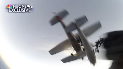 Video: Incredible footage as skydivers jump to safety after two planes collide midair
