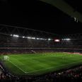 Arsenal fans shine a light on the Emirates Stadium after floodlights go out