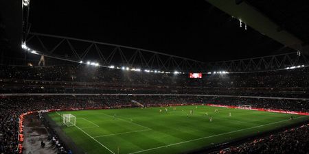 Arsenal fans shine a light on the Emirates Stadium after floodlights go out