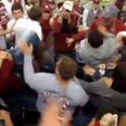 Video: Female fan goes absolutely berserk at college football game, attacking other supporters