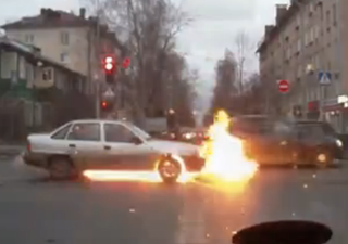 Video: Dash-cam captures the moment a car spontaneously combusts on Ukrainian road