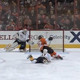Video: Ice hockey goalie makes incredible diving save
