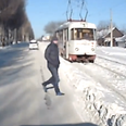 Video: Russian man barely escapes collision with tram