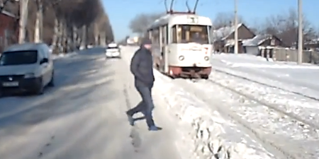 Video: Russian man barely escapes collision with tram
