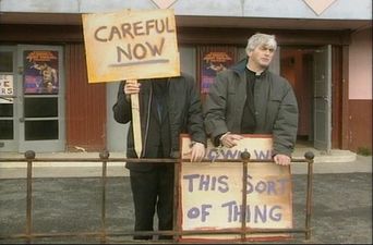 Pic: ‘Careful Now’. Irish lads display famous Father Ted placards at a protest in Taiwan