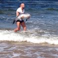 Pic of the day: Cathal Pendred saves a stricken dolphin in Doonbeg