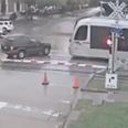 Video: Idiotic driver tries to break through level crossing… fails