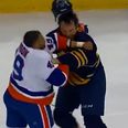 Video: Medium-sized ice-hockey player levels giant ice-hockey player with brutal left hook