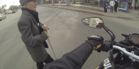 Video: Good guy biker stops traffic for elderly pedestrian