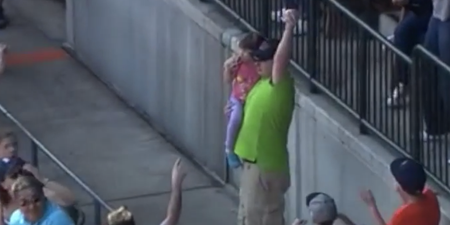 Video: Detroit Tigers fan grabs baseball while holding young daughter