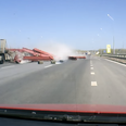 Video: Truck spills load into oncoming traffic