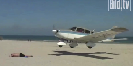 Video: Plane lands perilously close to sleeping sunbather’s head