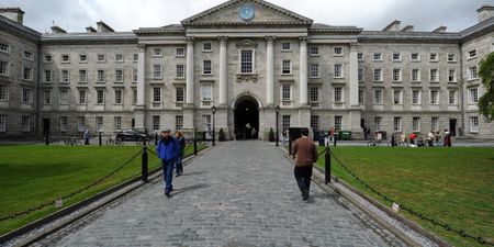 George Takei uses a sign in Trinity College to give the definition of irony