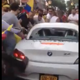 Video: Watch as rowdy Colombian football fans smash up a BMW Z4 in New York