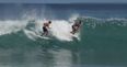 Video: Two surfers end up in a fight while still on their boards on a wave