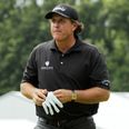 Phil Mickelson hits a shot from the top of the hospitality tent at the Barclays