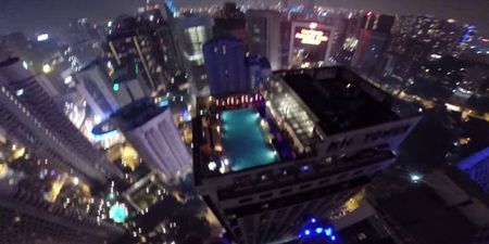 Video: Incredible GoPro footage captures a base jump into a Kuala Lumpur hotel swimming pool from 1,100 feet