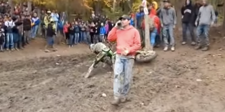 Video: Motocross spectator jumps over rider while taking a phone call