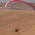 Video: Nothing to see here… Just a man paragliding on a Harley-Davidson