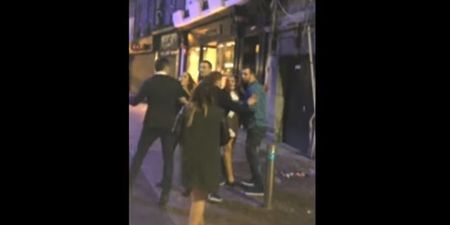 Video: Busker in Galway keeps singing despite a scrap breaking outside beside him