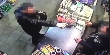 Video: Shopkeeper nonchalantly snatches a gun away from a would-be armed robber