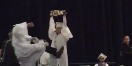 Vine: A guy hits his friend with a Stone Cold Stunner on stage at their graduation