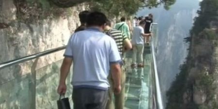 PIC: This terrifying glass walkway 3,500 ft up a cliff in China has started cracking under tourists’ feet