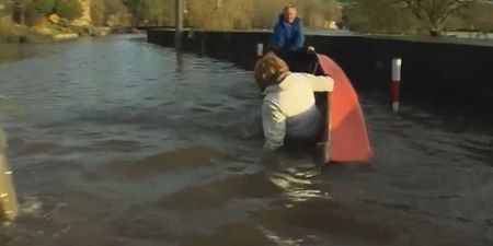 VIDEO: Tánaiste Joan Burton falling out of a boat in Kilkenny floods