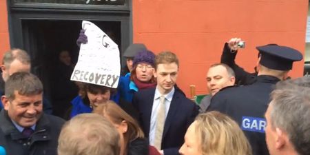 VIDEO: Angry bystanders tell Enda Kenny to “get the f**k out of Wicklow”