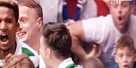 WATCH: Disgusting scenes at Old Firm as Rangers fan seems to make racist monkey gesture to Scott Sinclair
